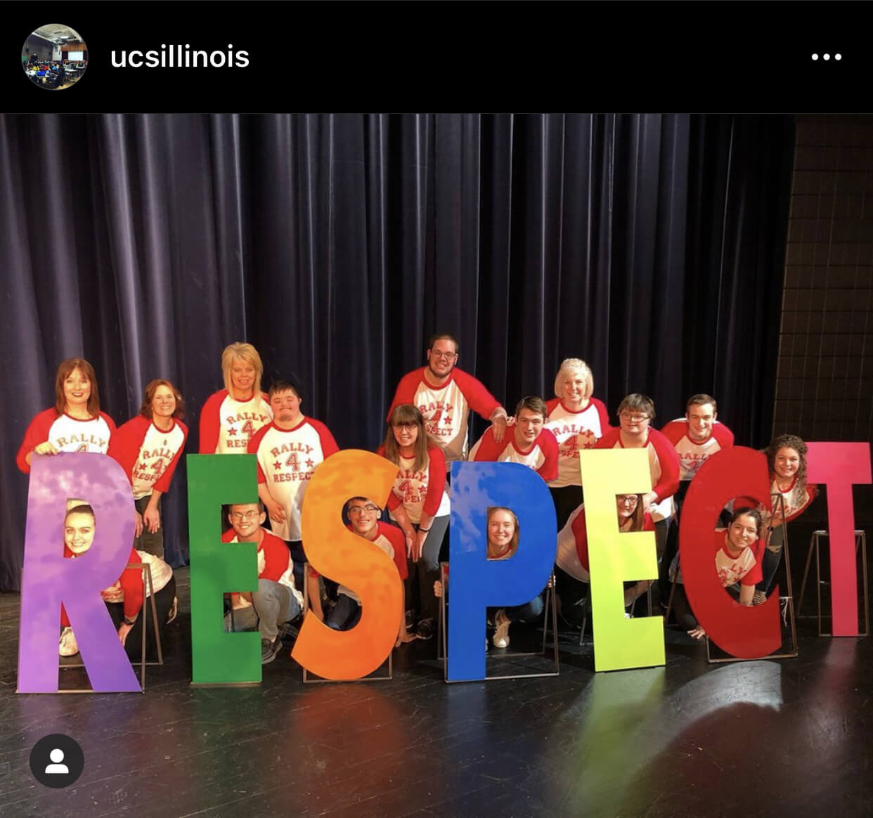 Students with cut out letters that spell respect.